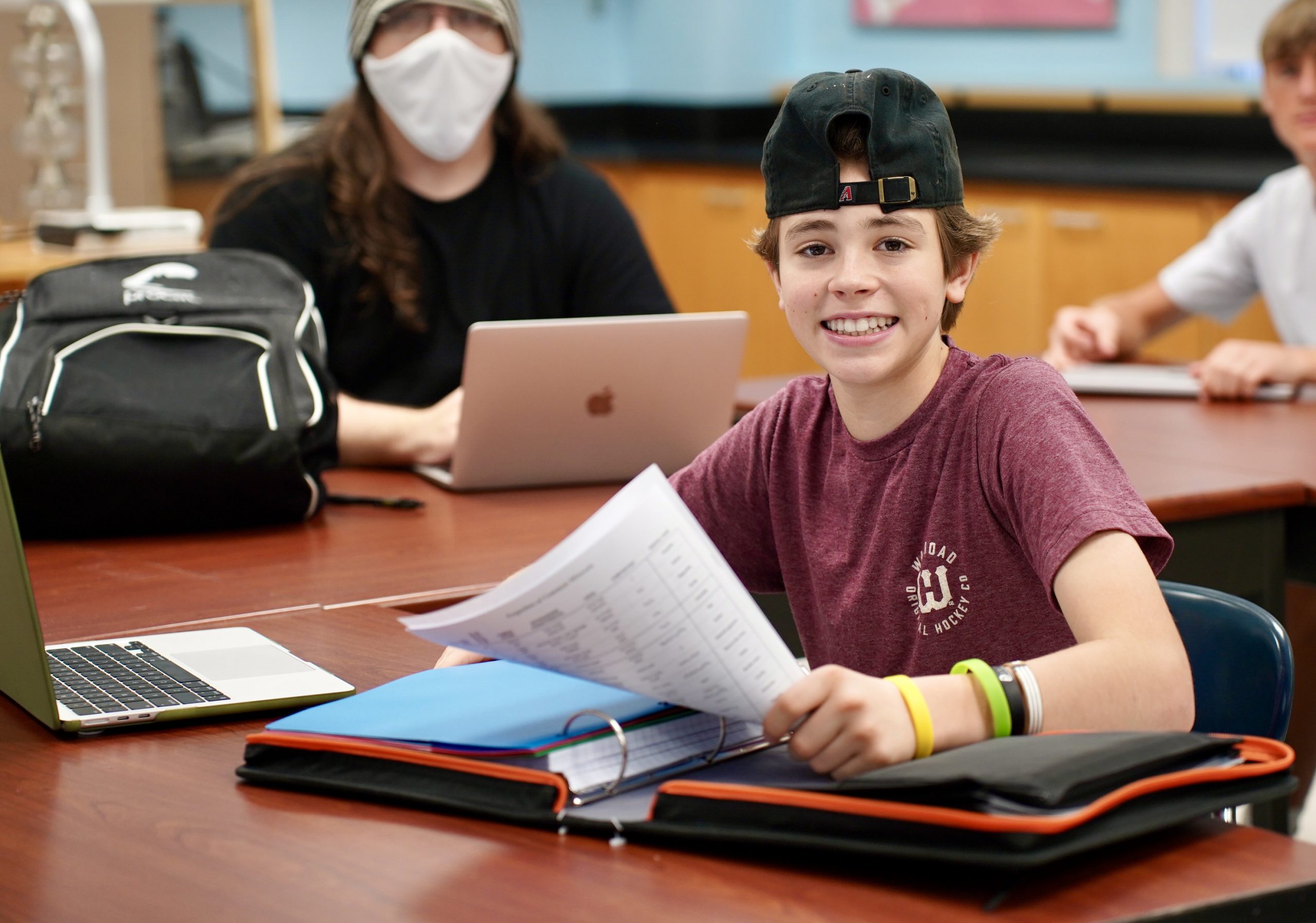 Student sitting at desk in classroom