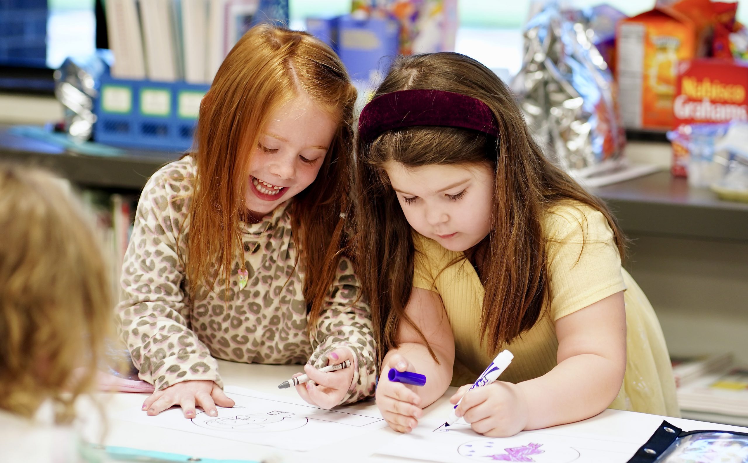 Teacher and student doing art activity together