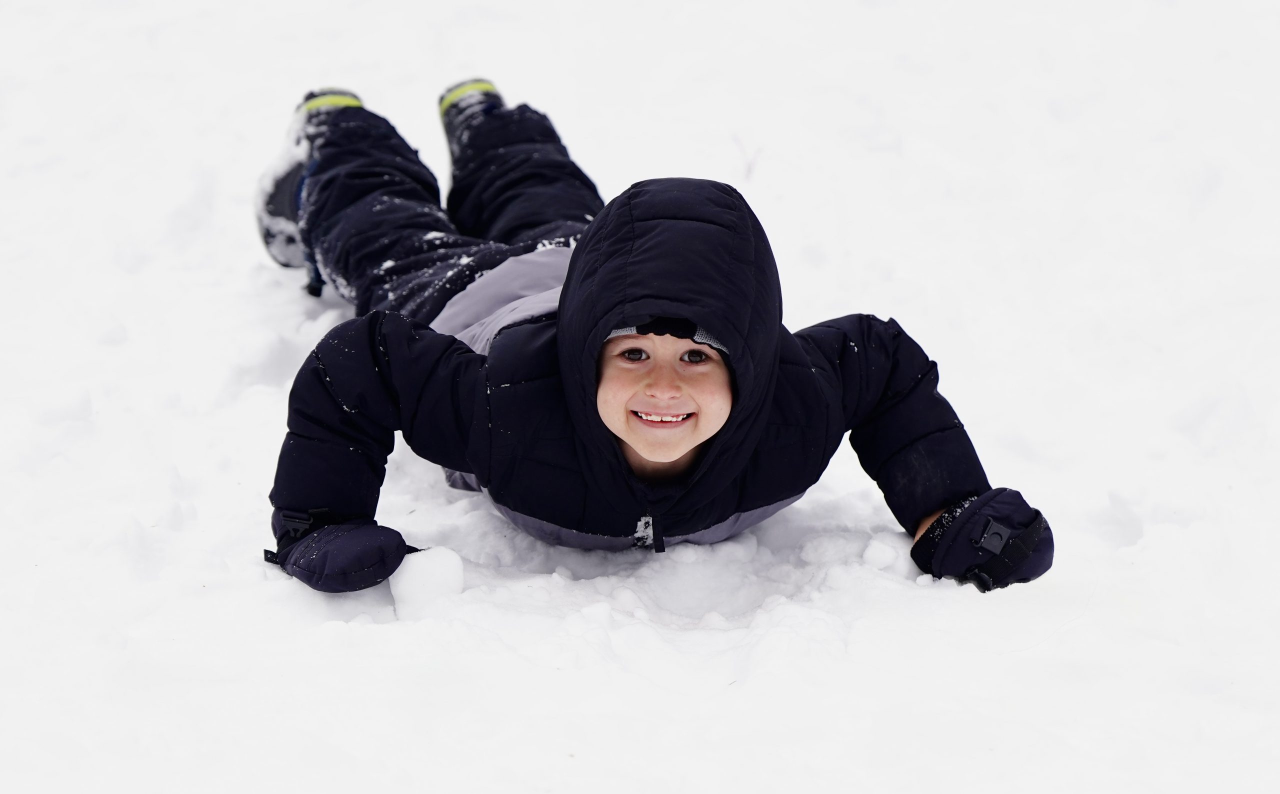 Students sitting on floor of classroom