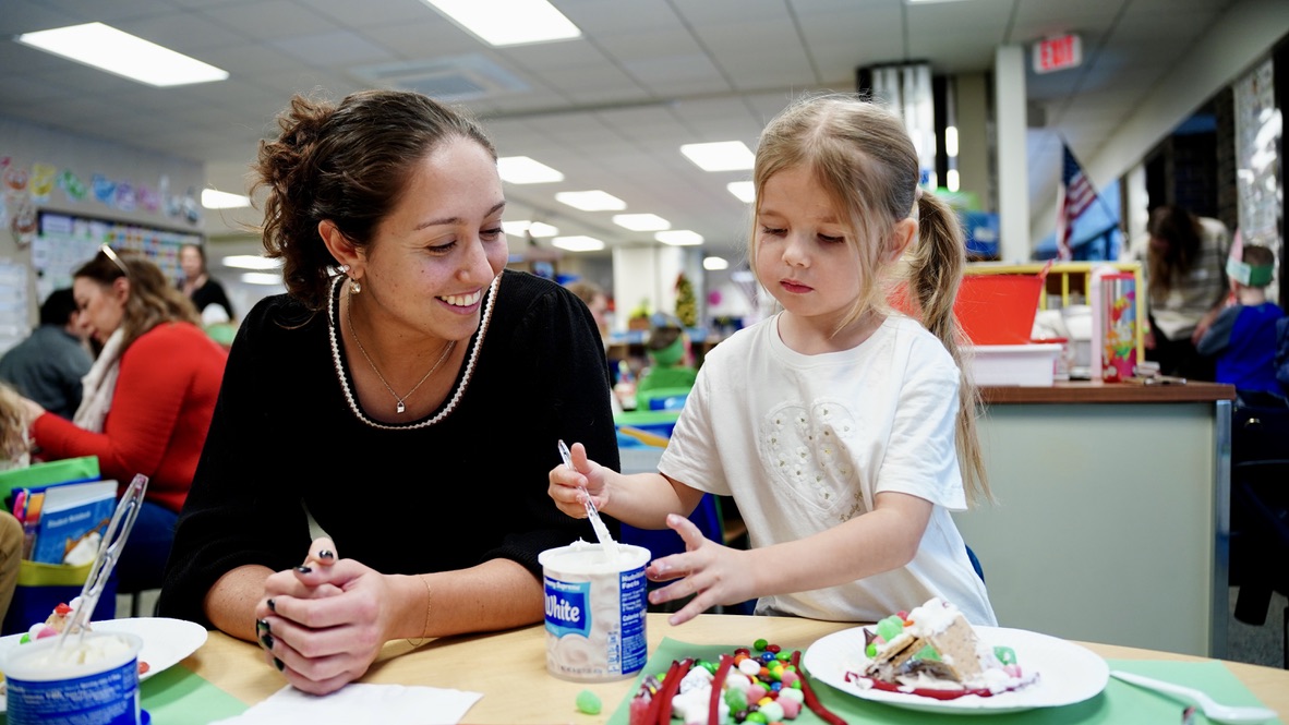 Teacher and student doing art activity together