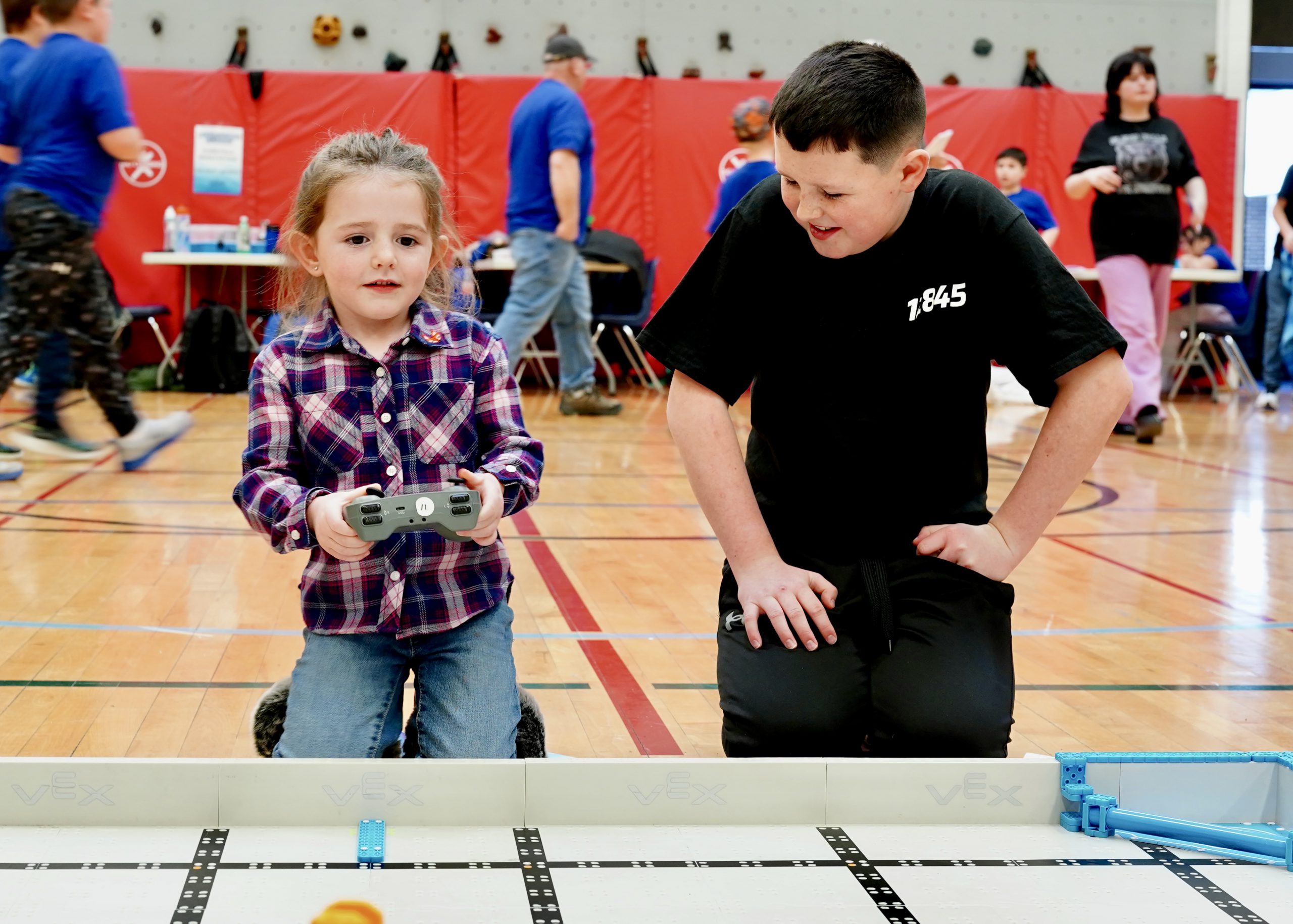 Former teacher sits with senior at picnic table