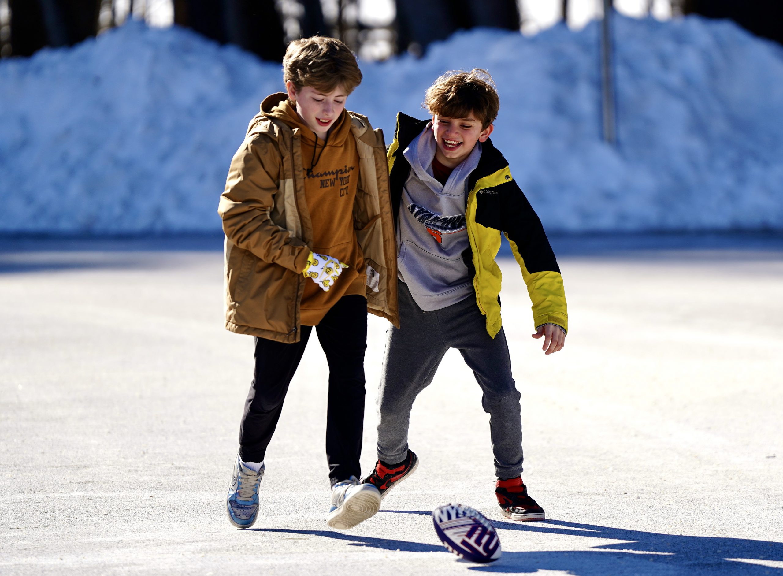 Students sitting on floor of classroom