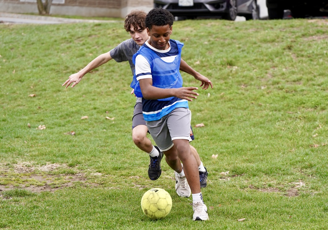 Students toss graduation caps at the 2025 graduation ceremony