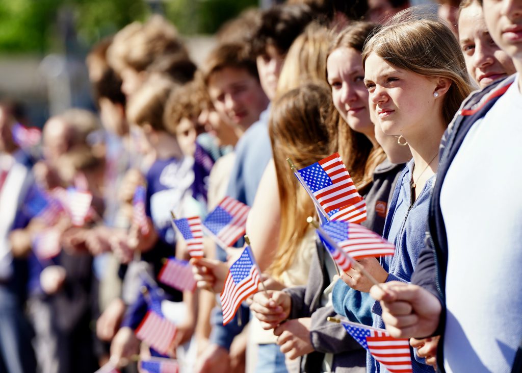 students holding American flags