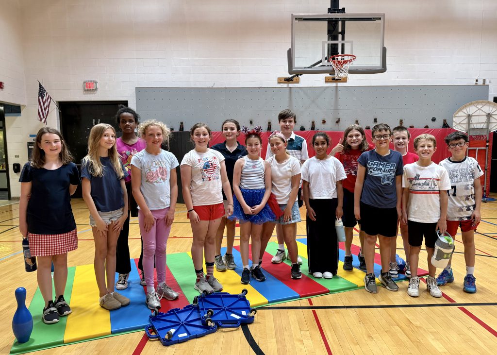 group of students standing in a gym
